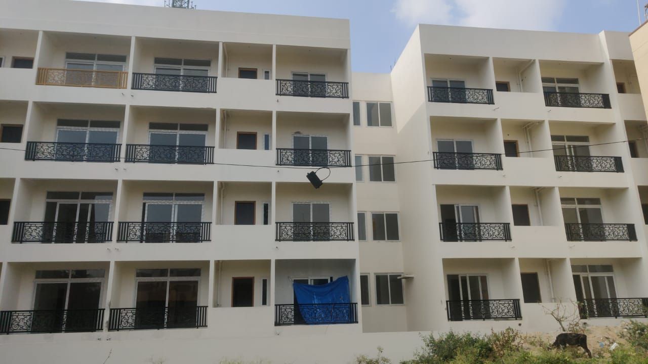 Premiera Regency — twin apartment blocks with wrought-iron balconies
