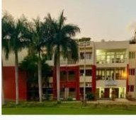 ISI Guest House — facade at dusk with warm lighting